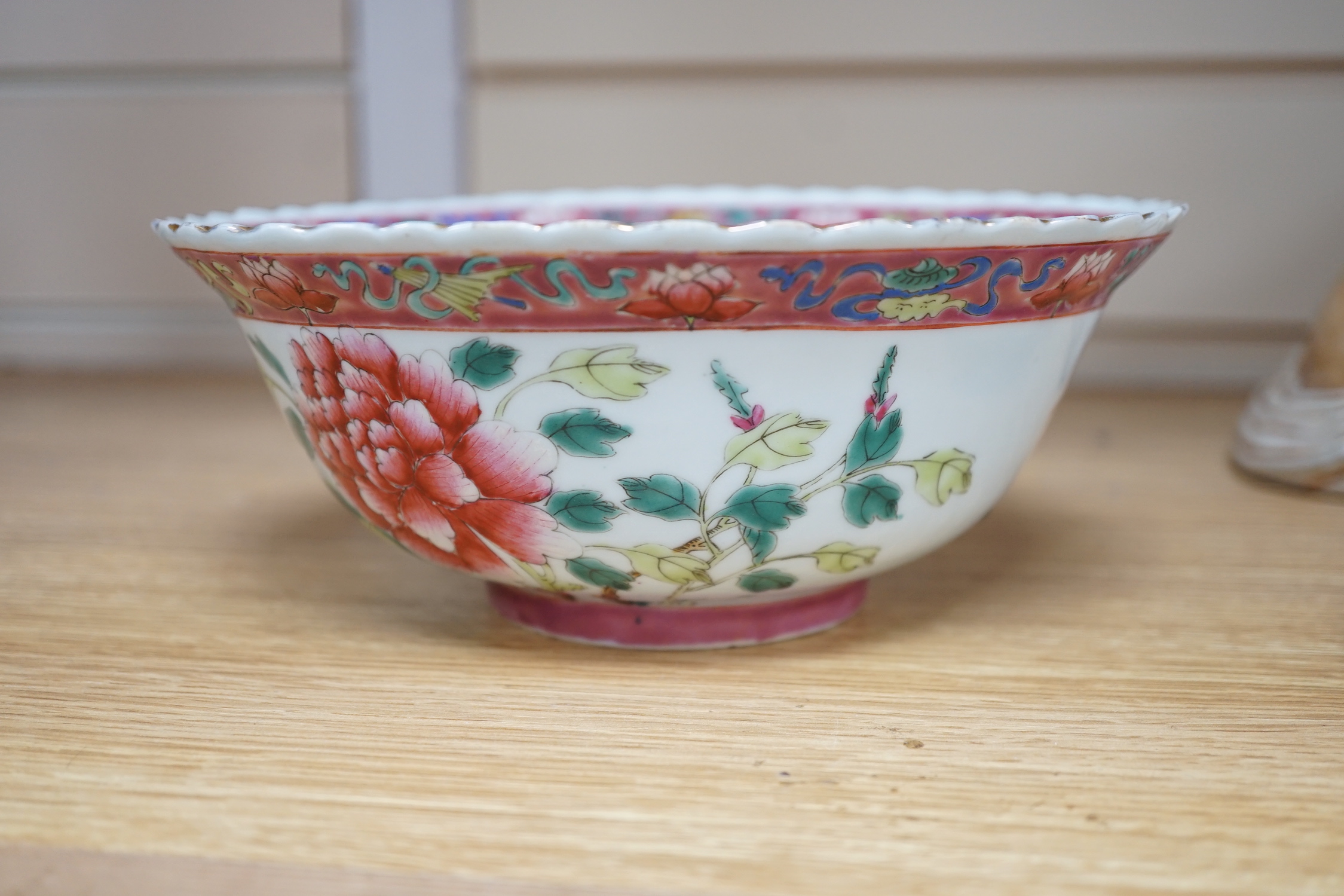 A Chinese Straits famille rose ‘phoenix’ bowl, 19cm diameter